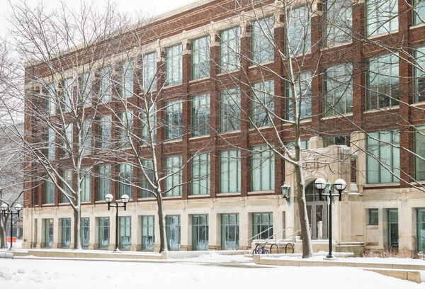 The North University side of the brick School of Kinesiology building on a winter day