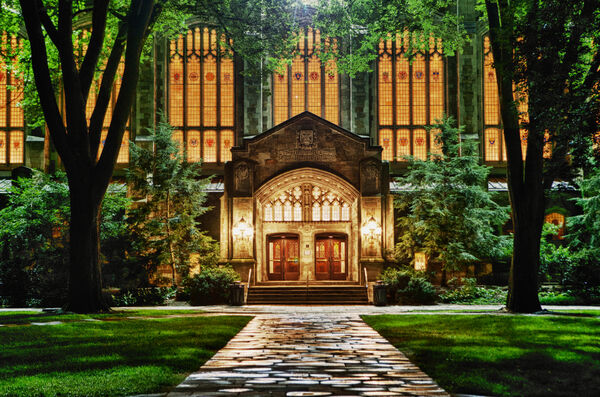 The Tudor Gothic Law Quad lit up at night