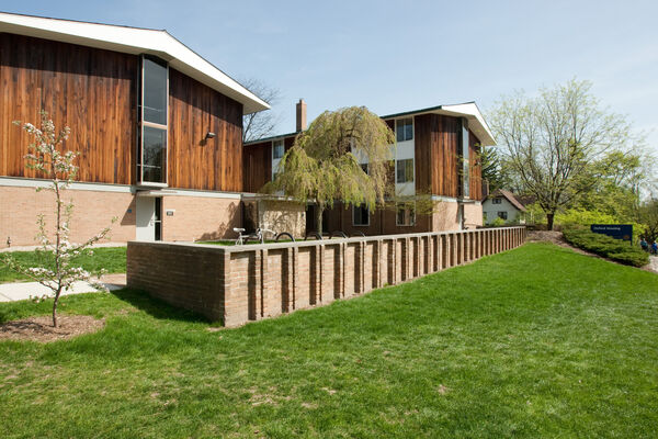 Two of the wood-sided houses that make up Oxford Housing