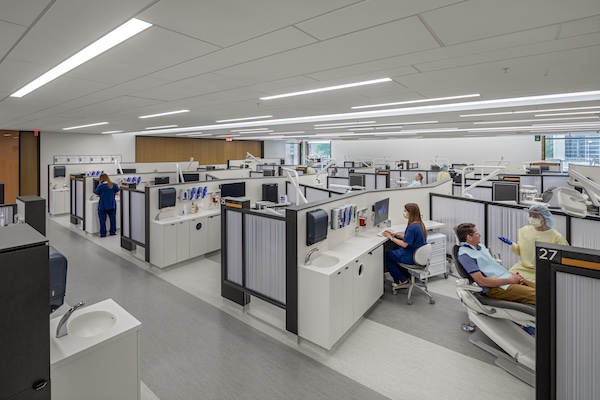 People working in a patient clinic