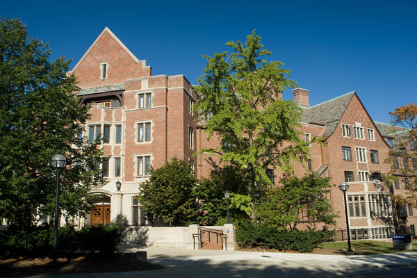 The corner entrance of Stockwell Hall with green trees