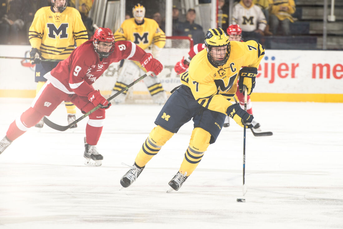 Players skating during a hockey game at Yost Ice Arena